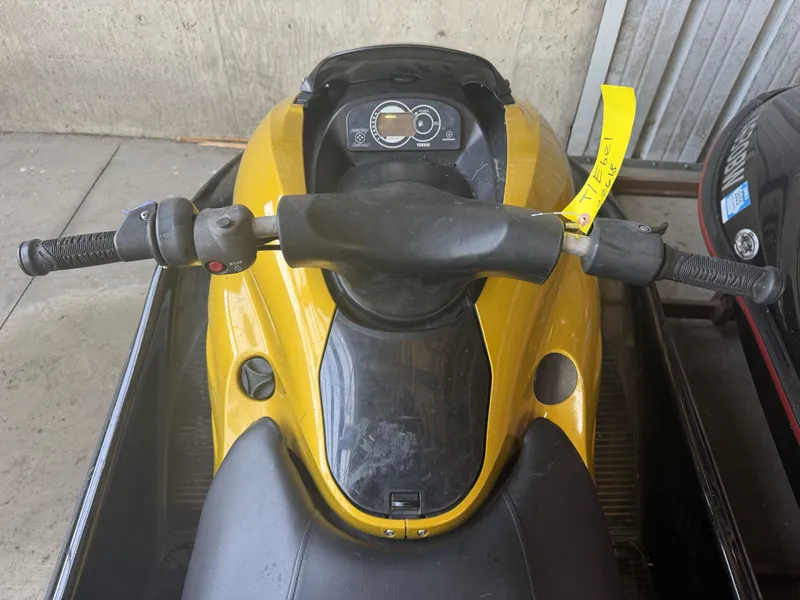 Slide: The Image of A yellow 2006 Yamaha GP1300R jet ski with black handlebars and dashboard. - 14