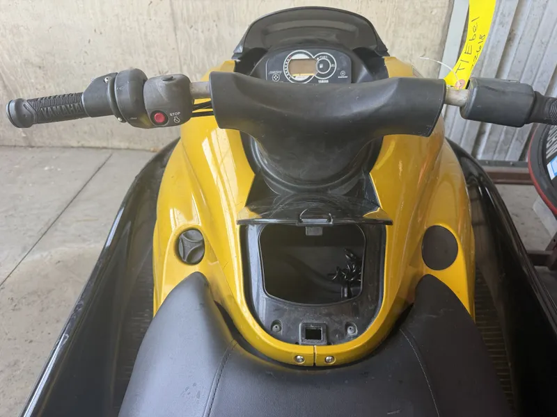 Slide: The Image of A yellow 2006 Yamaha GP1300R jet ski with a black seat and handlebars. - 15