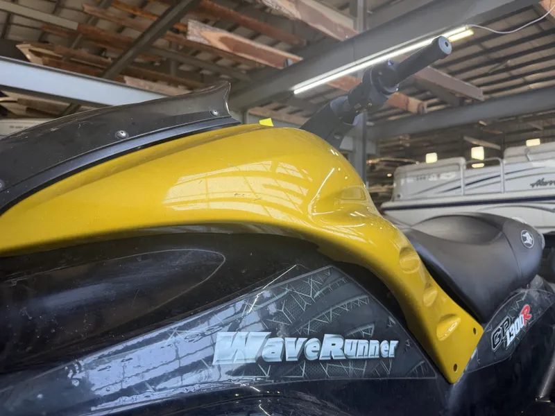 Slide: The Image of Close-up of a yellow 2006 Yamaha GP1300R WaveRunner in a storage facility. - 3