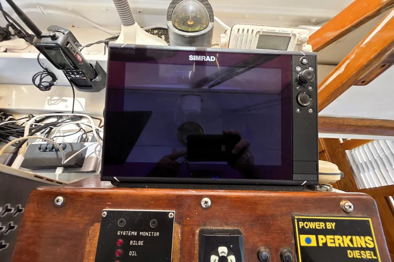 Slide: The Image of Control panel of a 1978 Roughwater 41 twin cabin boat with Simrad display and Perkins Diesel system. - 29
