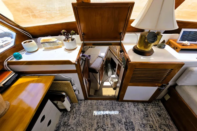 Slide: The Image of Interior of a 1978 Roughwater 41 twin cabin with wooden accents and decor. - 4