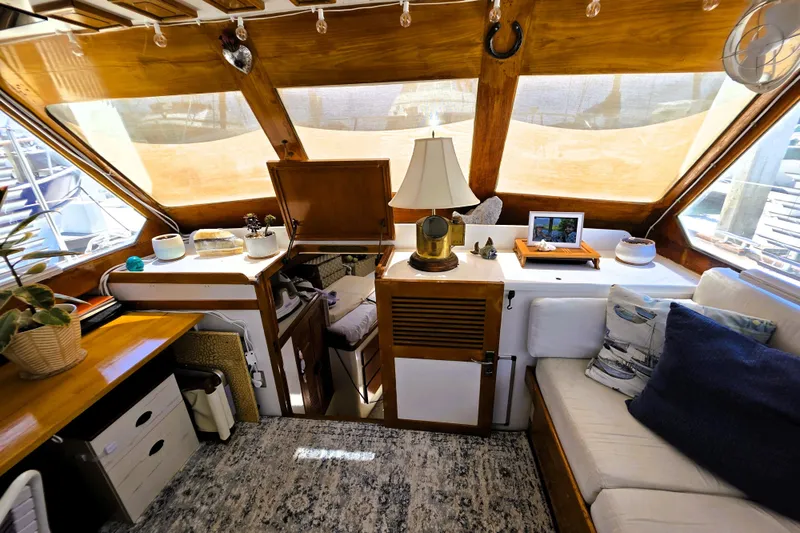 Slide: The Image of Cozy interior of 1978 Roughwater 41 twin cabin yacht with wooden accents and decor. - 3
