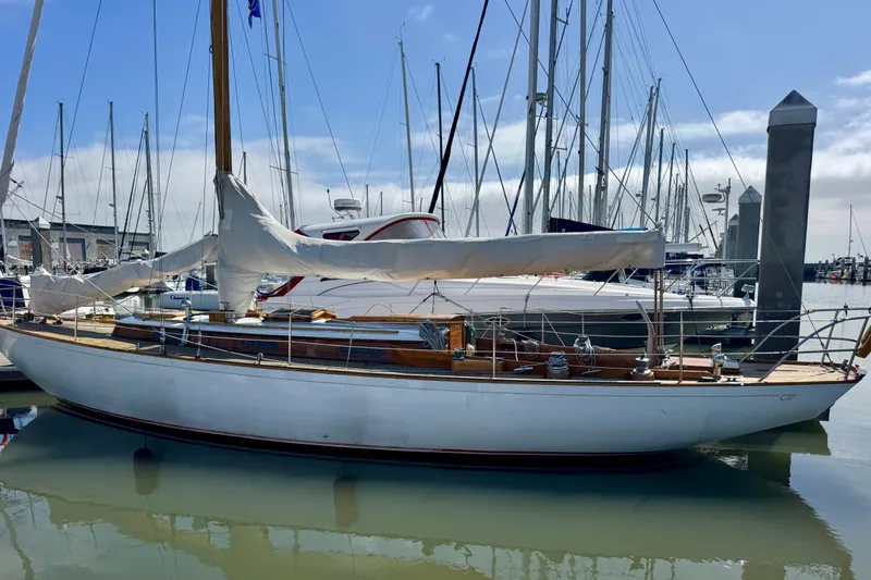 Slide: The Image of Classic 1955 Henry R Hinckley Owens Cutter sailboat docked in a marina. - 3