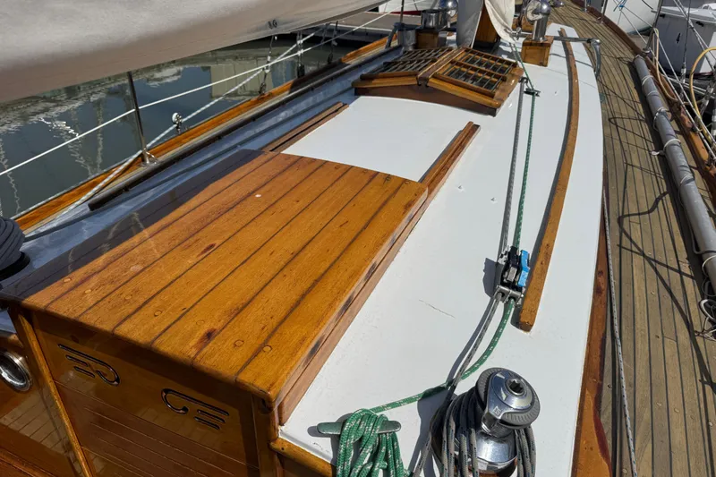 Slide: The Image of 1955 Henry R Hinckley Owens Cutter deck with polished wood and rigging details. - 20