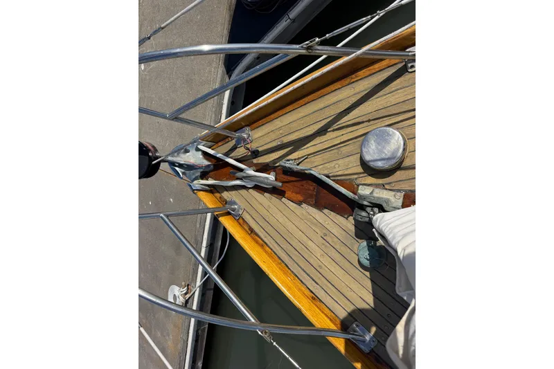 Slide: The Image of 1955 Henry R Hinckley Owens Cutter deck with wooden finish and metal fittings. - 19