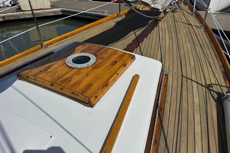 Slide: The Image of 1955 Henry R Hinckley Owens Cutter deck with wooden details and porthole. - 22