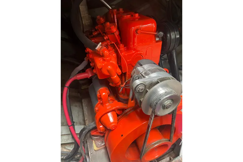 Slide: The Image of Red engine of a 1955 Henry R Hinckley Owens Cutter, showcasing mechanical components. - 25