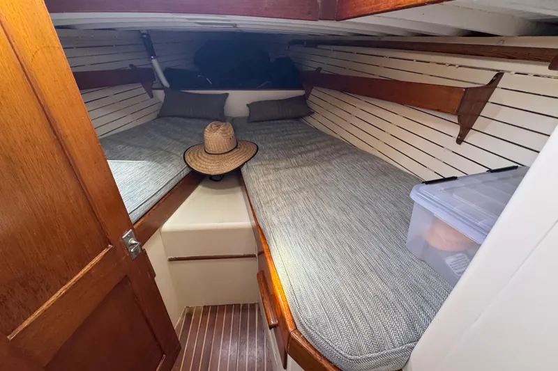 Slide: The Image of Cozy cabin interior of 1955 Henry R Hinckley Owens Cutter with wooden accents and bedding. - 15