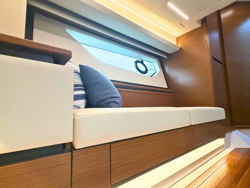 Slide: The Image of Interior of the Tiara Yachts 48 LE with elegant wood paneling and a comfortable bench. - 29