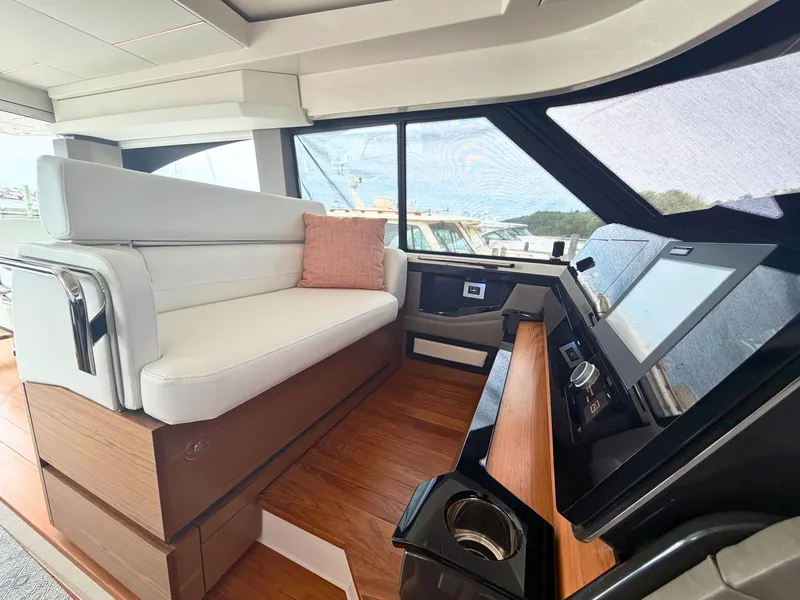 Slide: The Image of Interior of the Tiara Yachts 48 LE with elegant seating area and modern helm console. - 16