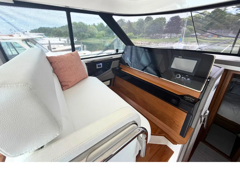 Slide: The Image of Interior of the Tiara Yachts 48 LE with modern helm and comfortable seating. - 15