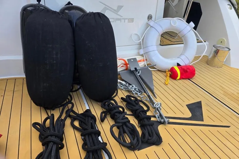 Slide: The Image of Deck of 2023 NX Boats 340 Sport Coupe with boating equipment and accessories. - 31