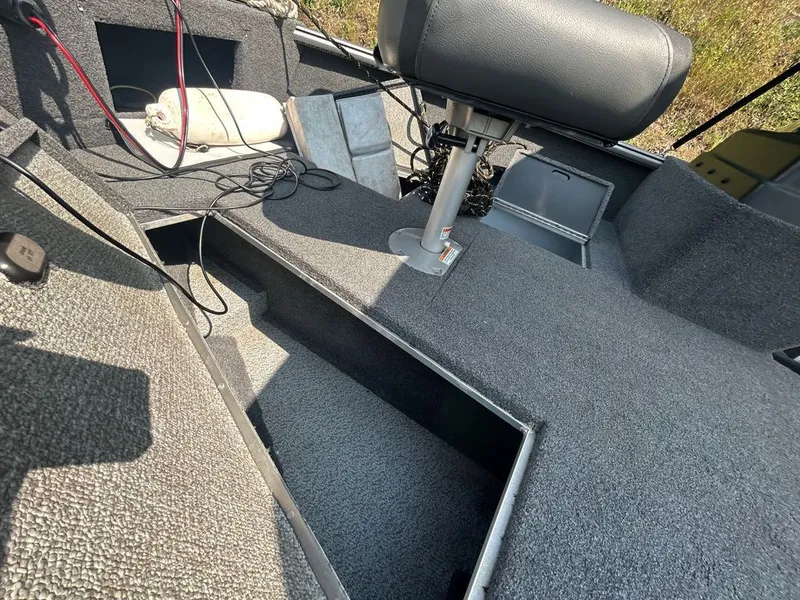 Slide: The Image of Interior view of a 2019 Lund 1675 Impact SS with gray carpeting and seating. - 9