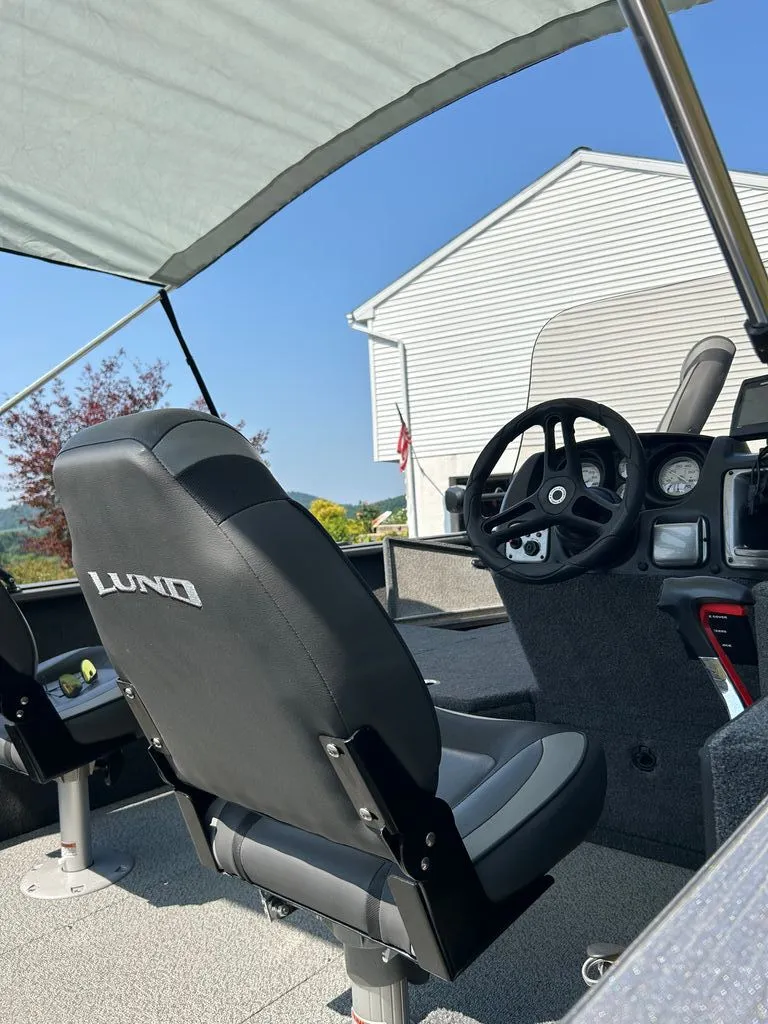 Slide: The Image of Interior view of a 2019 Lund 1675 Impact SS boat with helm and seating. - 4