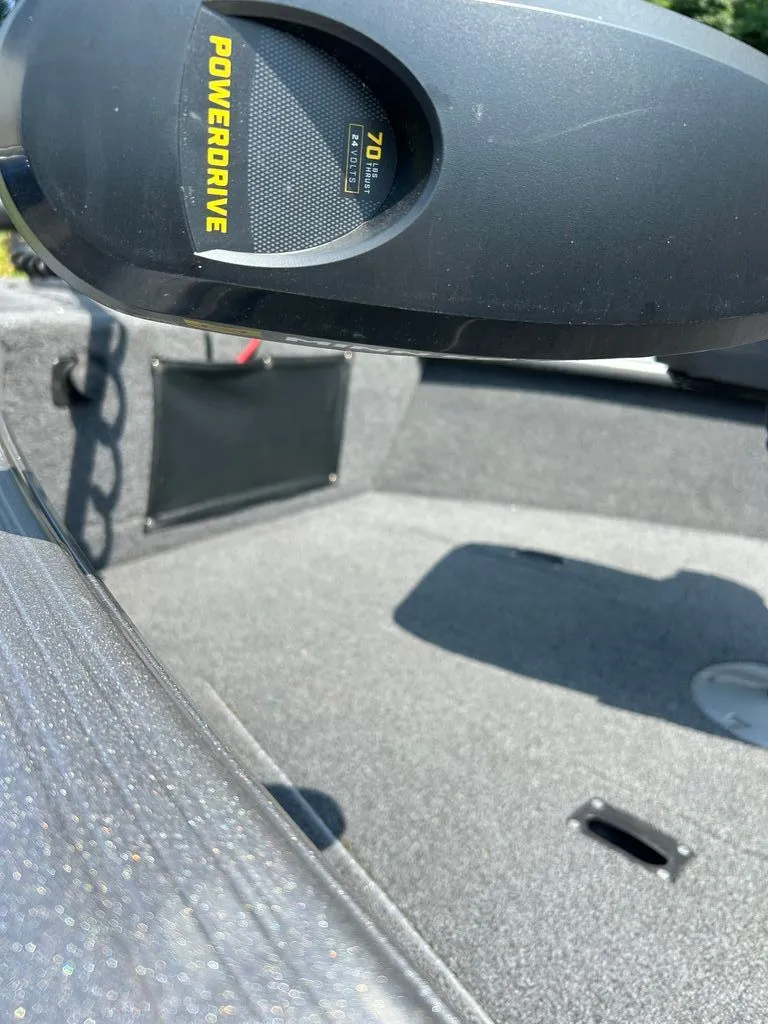 Slide: The Image of Close-up of a boat deck with gray carpet and a PowerDrive motor. - 12