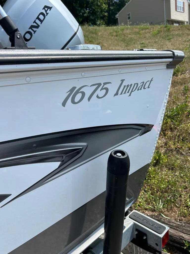 Slide: The Image of Close-up of the 2019 Lund 1675 Impact SS with a Honda engine. - 18