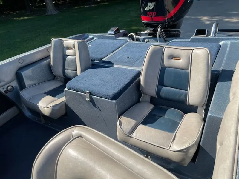 Slide: The Image of Interior of a 1984 Ebbtide Dyna-Trak with two cushioned seats and an engine. - 2
