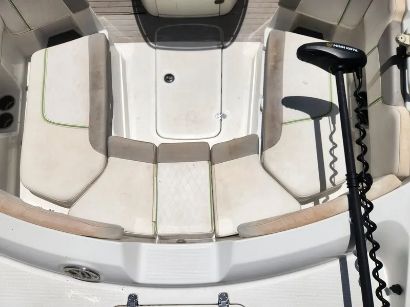 Slide: The Image of Interior view of a 2018 Tahoe 2150 CC with beige seating and a Minn Kota trolling motor. - 5