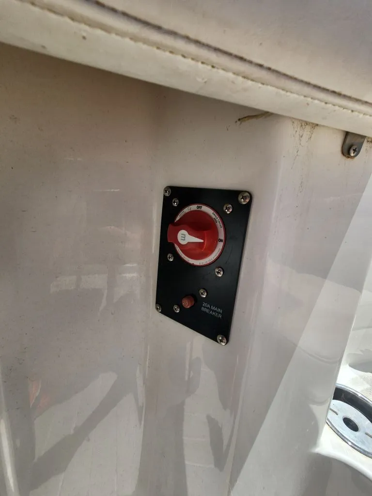 Slide: The Image of Close-up of a switch on a boat, surrounded by white material. - 6