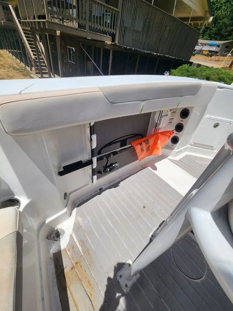 Slide: The Image of The image shows a boat interior with storage space and safety equipment. - 2