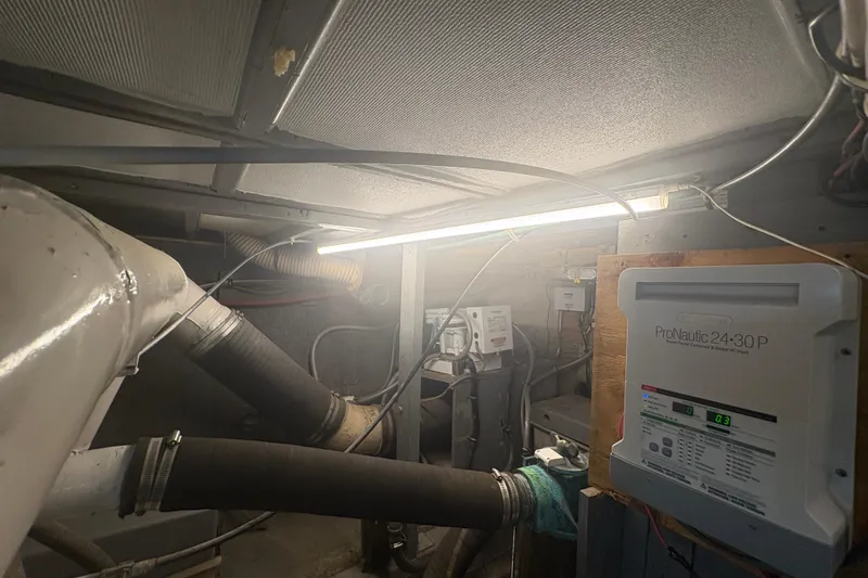 Slide: The Image of Engine room of a 1973 Hatteras 53 Convertible with ProNautic charger and ventilation system. - 107