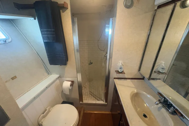 Slide: The Image of Bathroom interior of 1973 Hatteras 53 Convertible yacht with shower and sink. - 53