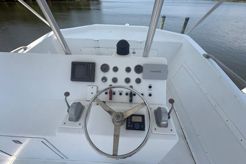 Slide: The Image of Helm of 1973 Hatteras 53 Convertible yacht with Garmin navigation system. - 69