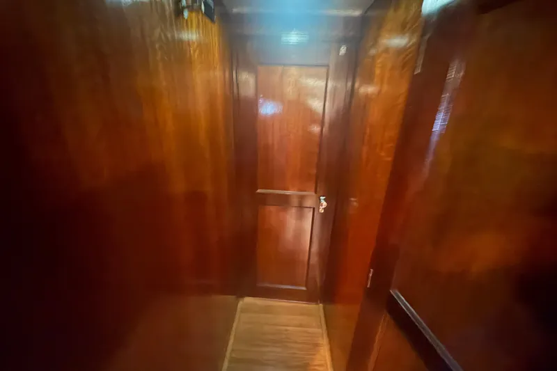 Slide: The Image of Wood-paneled interior hallway of a 1973 Hatteras 53 Convertible yacht. - 39