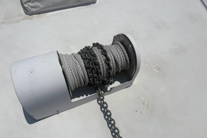 Slide: The Image of Anchor winch with rope and chain on 1973 Hatteras 53 Convertible boat deck. - 117