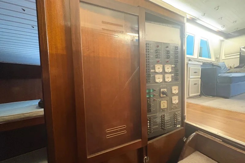 Slide: The Image of Electrical panel inside a 1973 Hatteras 53 Convertible yacht, showcasing vintage controls. - 30