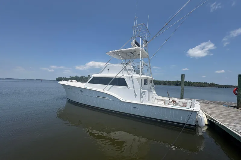 Slide: The Image of 1973 Hatteras 53 Convertible yacht docked on a calm, sunny day. - 88
