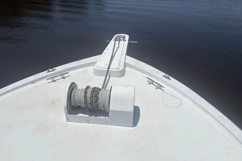 Slide: The Image of Bow of 1973 Hatteras 53 Convertible yacht with anchor chain and winch. - 114