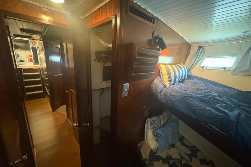Slide: The Image of Interior of 1973 Hatteras 53 Convertible yacht with cozy cabin and wooden finishes. - 40