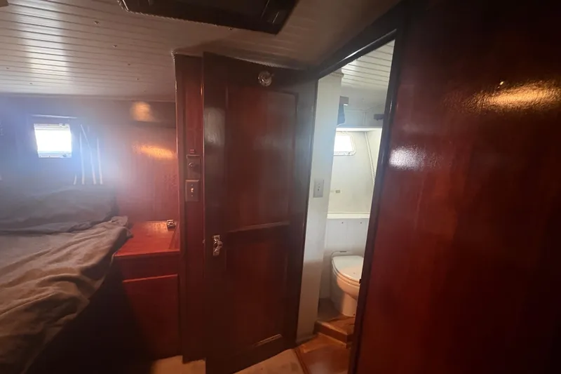 Slide: The Image of Interior of 1973 Hatteras 53 Convertible yacht showing cabin and bathroom. - 47