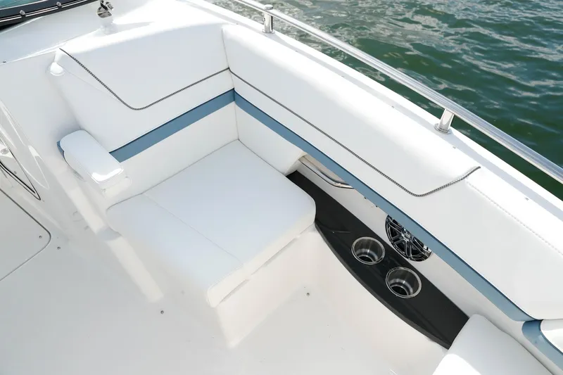 Slide: The Image of Manufacturer Provided Image: 2021 Formula 310 Bowrider OB boat interior seating with cup holders and speakers. - 12