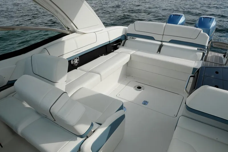 Slide: The Image of Manufacturer Provided Image: 2021 Formula 310 Bowrider OB interior with white seating and open deck. - 13