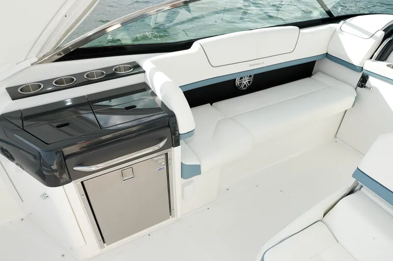 Slide: The Image of Manufacturer Provided Image: 2021 Formula 310 Bowrider OB interior with white seating and built-in mini fridge. - 11