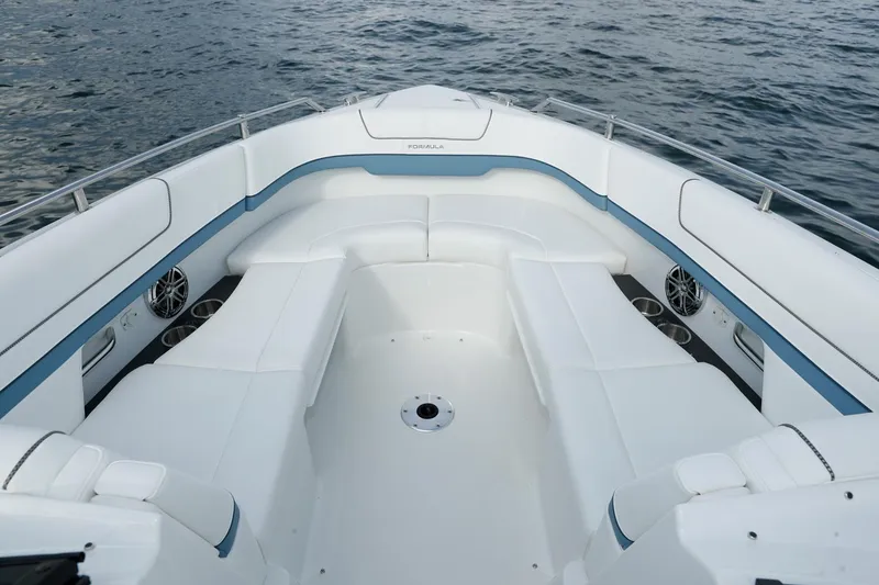 Slide: The Image of Manufacturer Provided Image: 2021 Formula 310 Bowrider OB boat interior with white seating and blue accents. - 7
