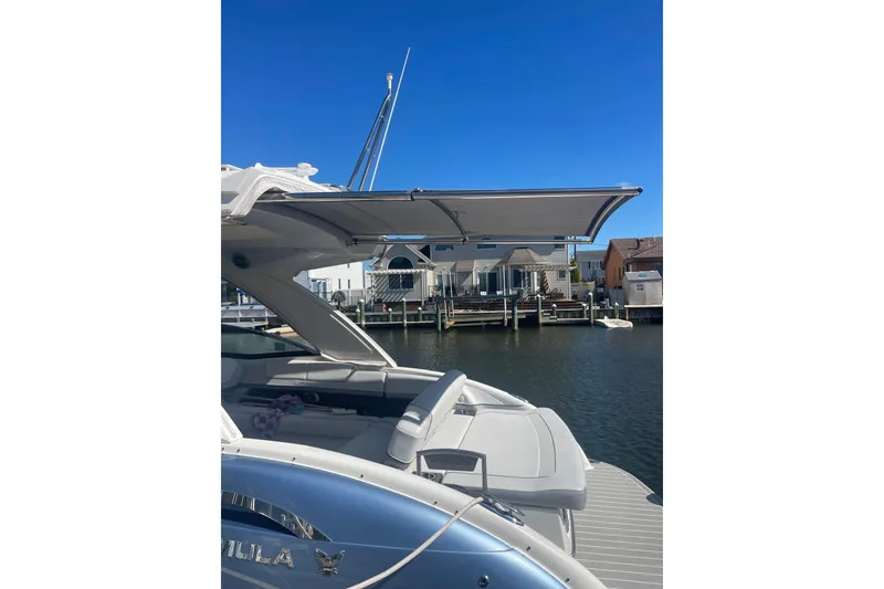 Slide: The Image of 2020 Formula 310 Bowrider OB docked, featuring sleek design and spacious seating. - 16
