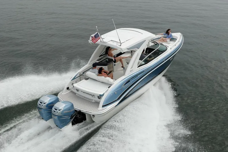 Slide: The Image of Manufacturer Provided Image: 2021 Formula 310 Bowrider OB cruising on water with passengers. - 2