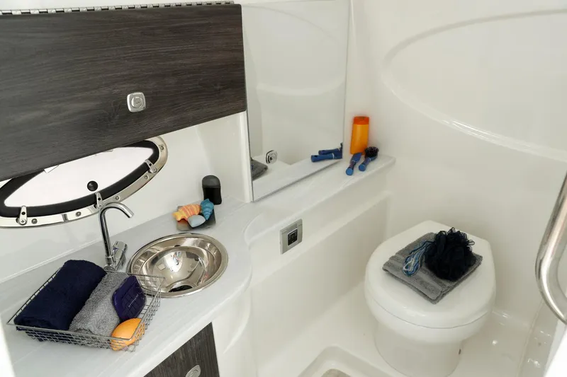 Slide: The Image of Manufacturer Provided Image: 2021 Formula 310 Bowrider OB bathroom with sink, toilet, and storage. - 20