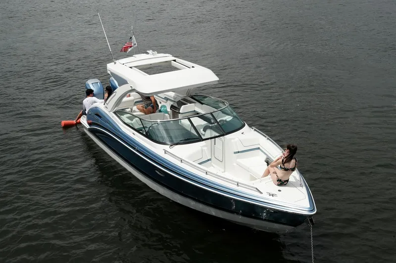 Slide: The Image of Manufacturer Provided Image: 2021 Formula 310 Bowrider OB on water with passengers enjoying the ride. - 3