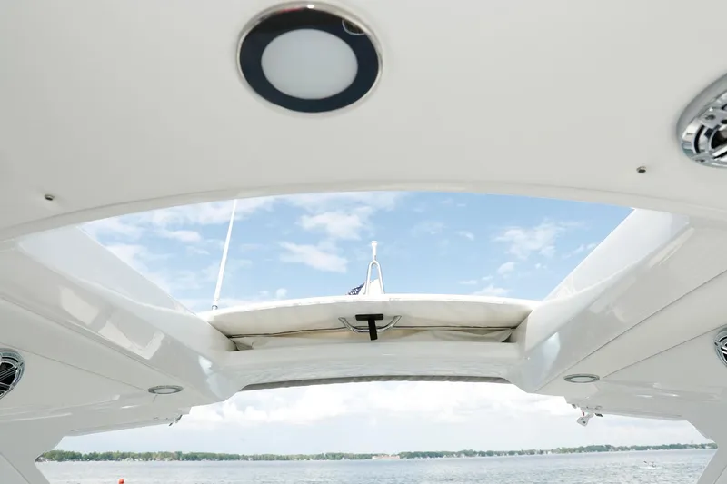 Slide: The Image of Manufacturer Provided Image: 2021 Formula 310 Bowrider OB boat roof view with sky and water background. - 5