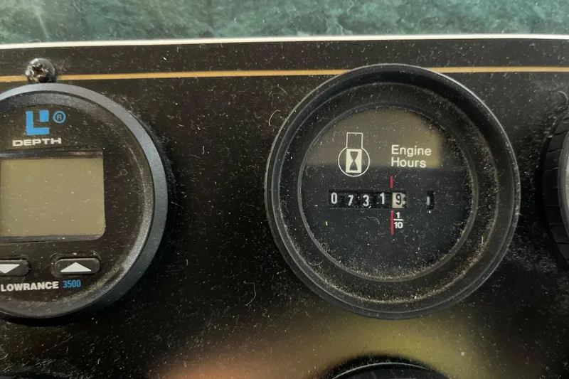 Slide: The Image of Close-up of Lakeview 65x18 boat gauges, showing engine hours and depth meter. - 30