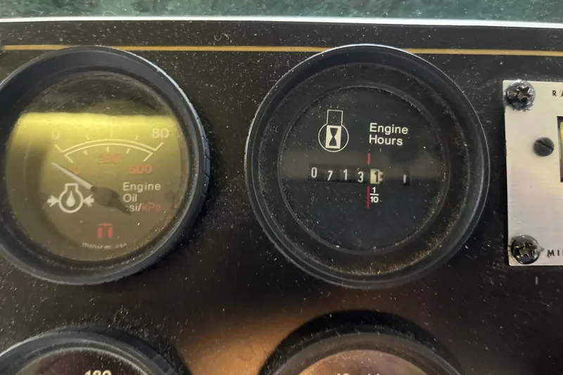 Slide: The Image of Close-up of Lakeview 65x18 engine gauges, showing oil pressure and engine hours, year 1997. - 31