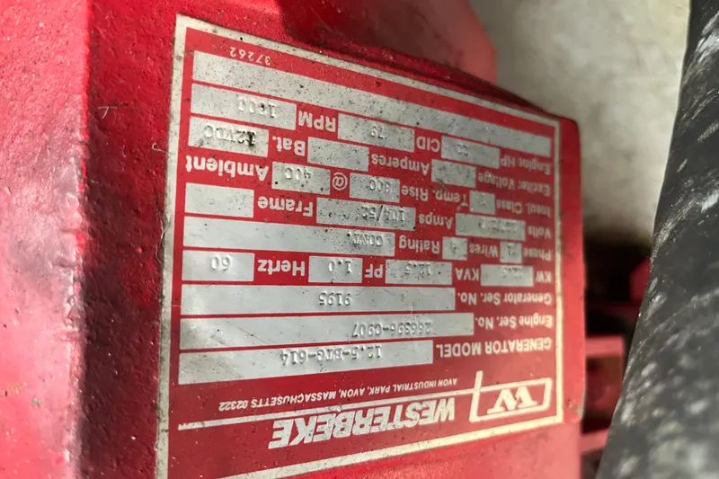 Slide: The Image of Close-up of a red Westerbeke generator label with technical specifications. - 34