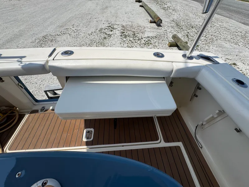 Slide: The Image of The image shows the cockpit of a 2002 Pursuit 3000 Express with a foldable table. - 18