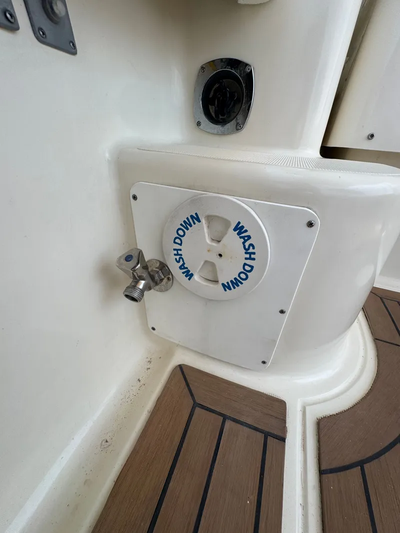 Slide: The Image of Washdown station on a 2002 Pursuit 3000 Express boat. - 22