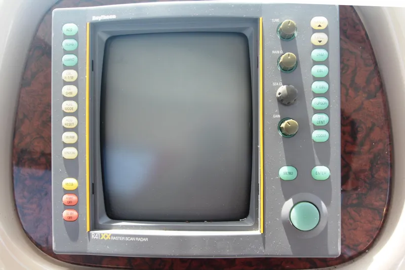 Slide: The Image of Raytheon radar display on 1999 Sea Ray 380 Sundancer boat dashboard. - 35