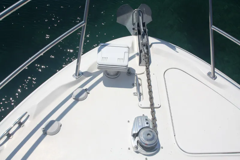 Slide: The Image of Bow of 1999 Sea Ray 380 Sundancer with anchor and chain in sunlight. - 78